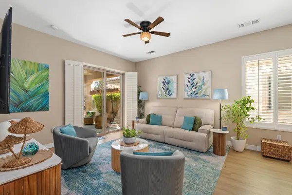 a living room with furniture and a large window