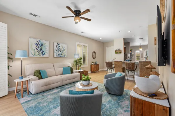 a living room with furniture and a large window