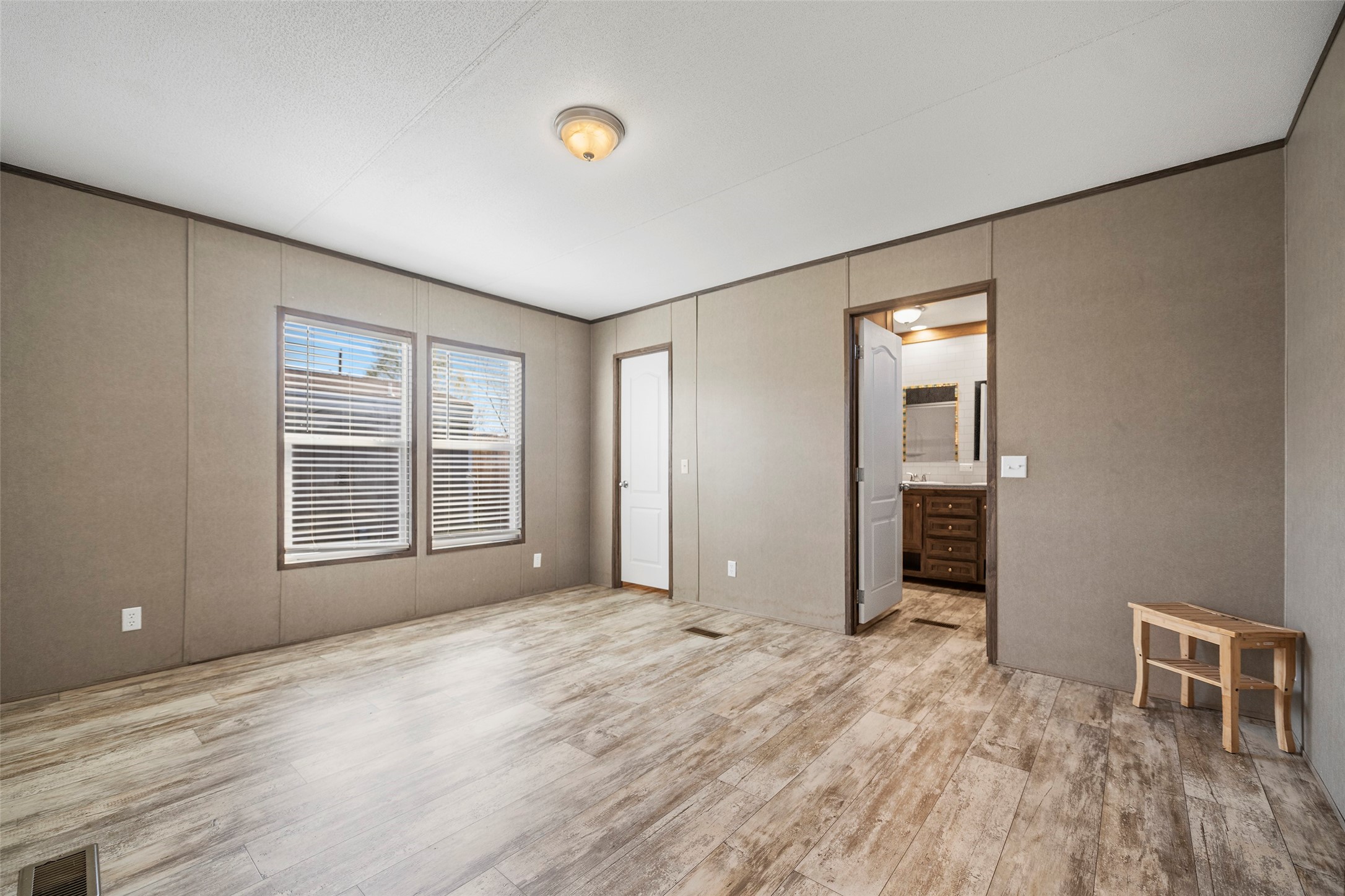 4343 Katy Hockley Road, Unit 27 Katy, TX 77493 - Photo 16 of 27 a view of empty room with wooden floor and fan