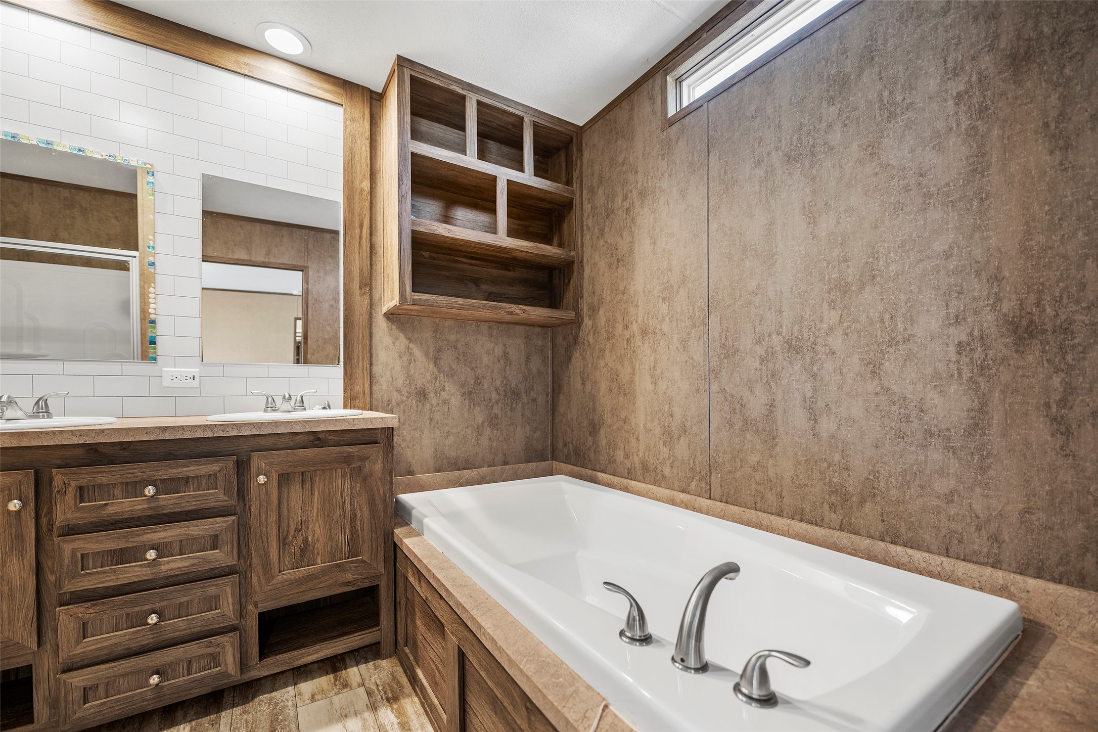 4343 Katy Hockley Road, Unit 27 Katy, TX 77493 - Photo 17 of 27 a bathroom with a tub sink and mirror