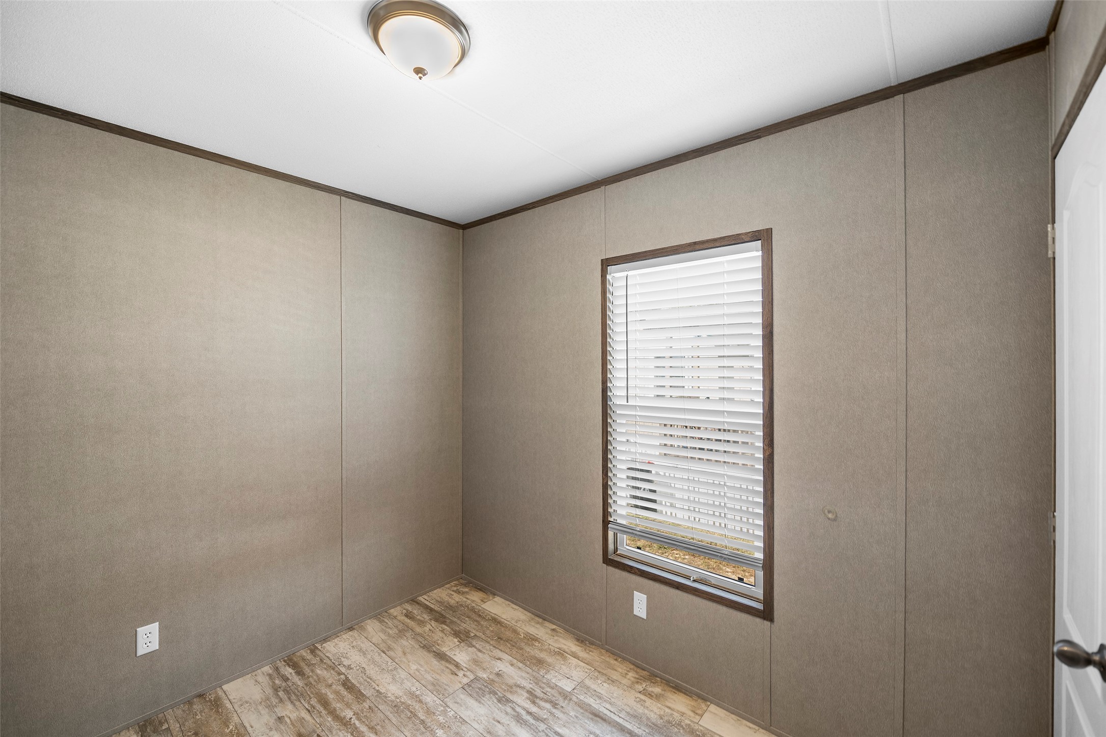 4343 Katy Hockley Road, Unit 27 Katy, TX 77493 - Photo 19 of 27 a view of a bedroom with a bed and a window