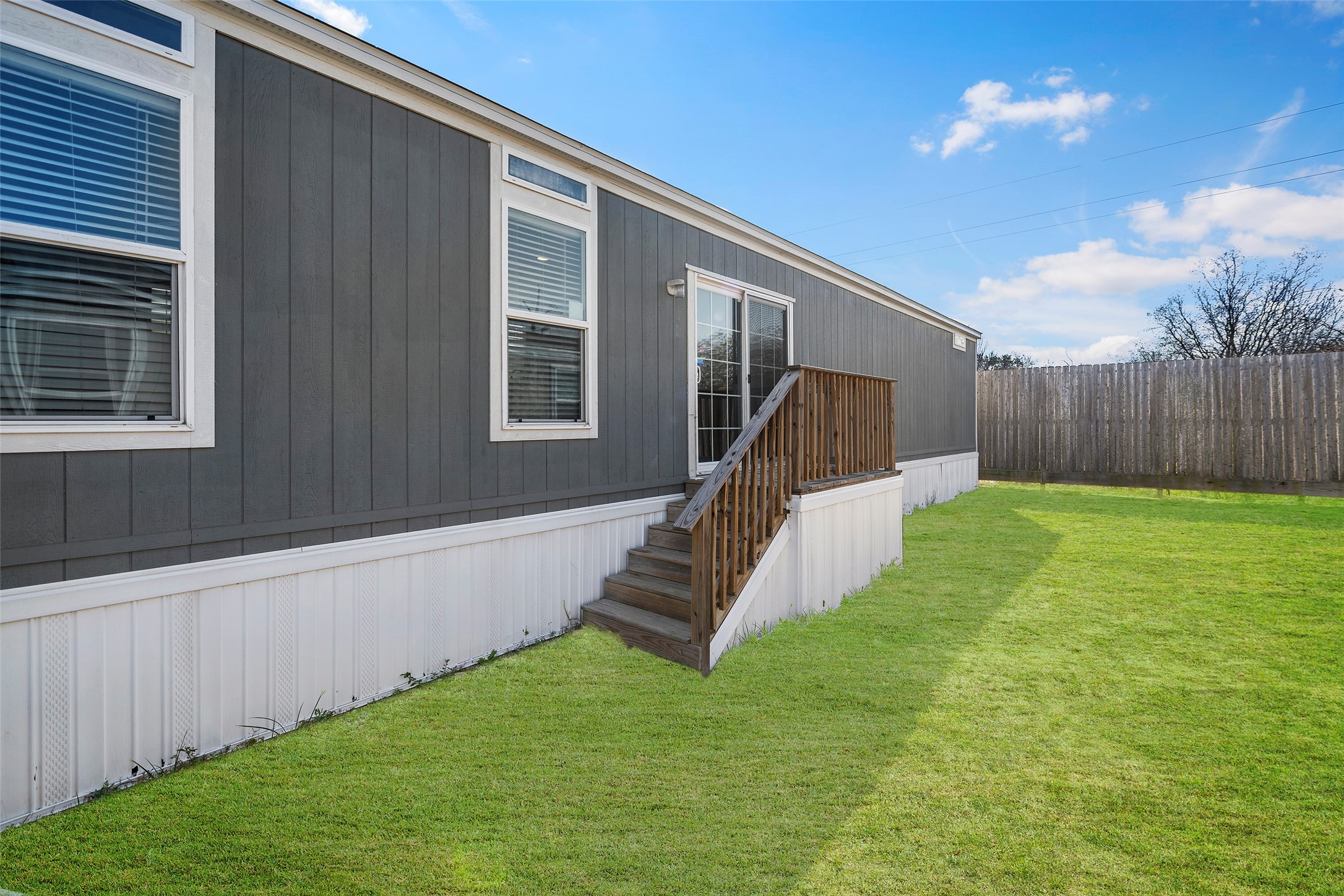4343 Katy Hockley Road, Unit 27 Katy, TX 77493 - Photo 25 of 27 a view of a house with a yard