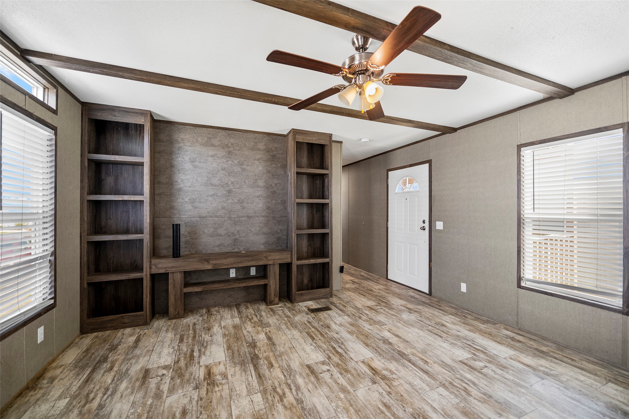 4343 Katy Hockley Road, Unit 27 Katy, TX 77493 - Photo 5 of 27 wooden floor in an empty room with a window