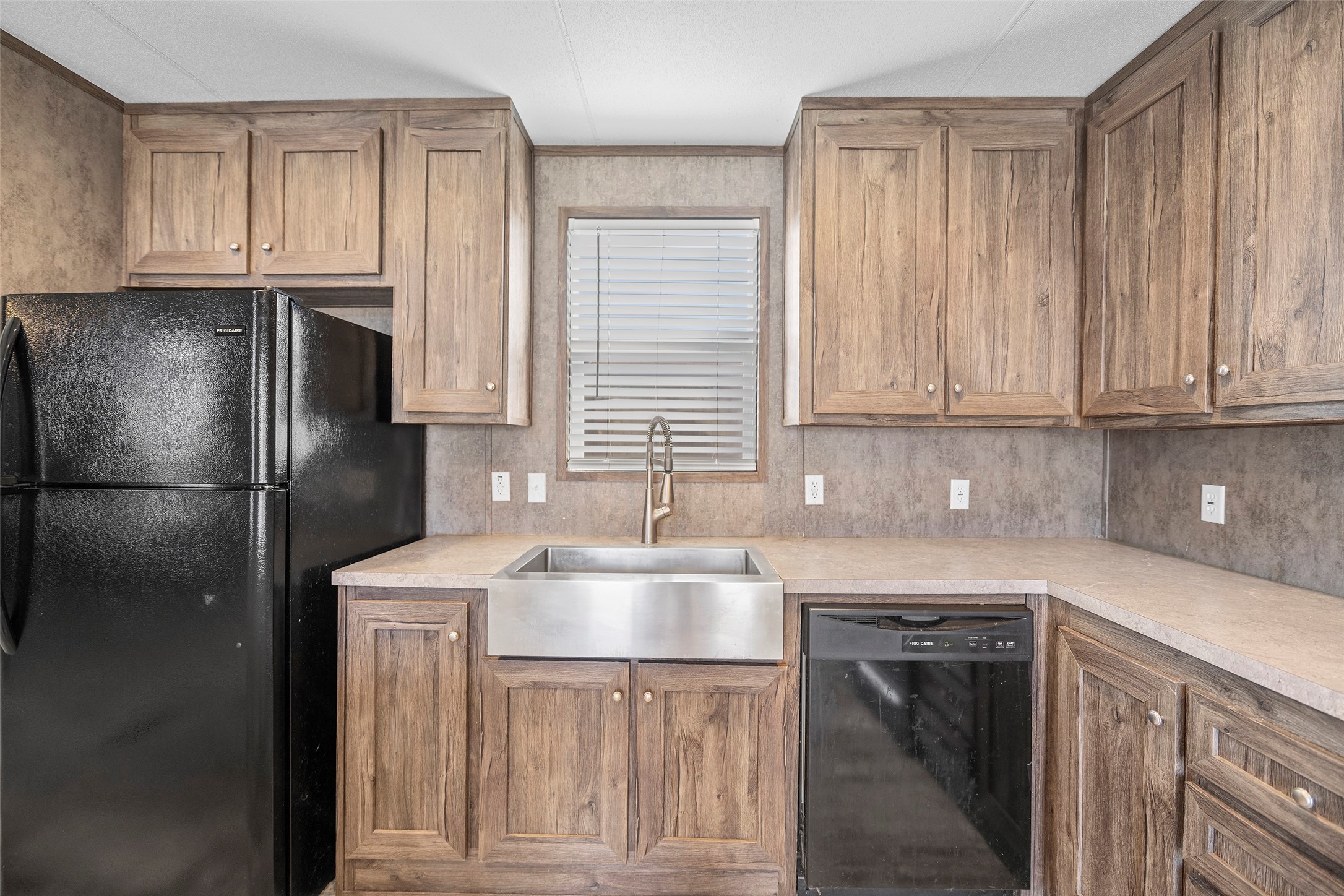4343 Katy Hockley Road, Unit 27 Katy, TX 77493 - Photo 10 of 27 a kitchen with stainless steel appliances granite countertop a refrigerator sink and cabinets