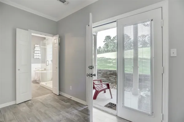 a view of a room with a balcony and chair