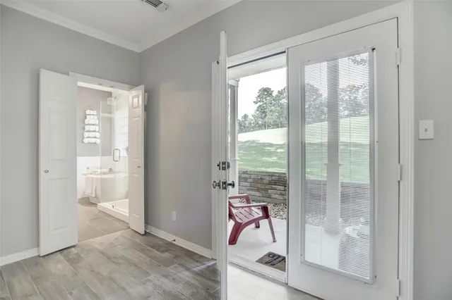 a view of a room with a balcony and chair