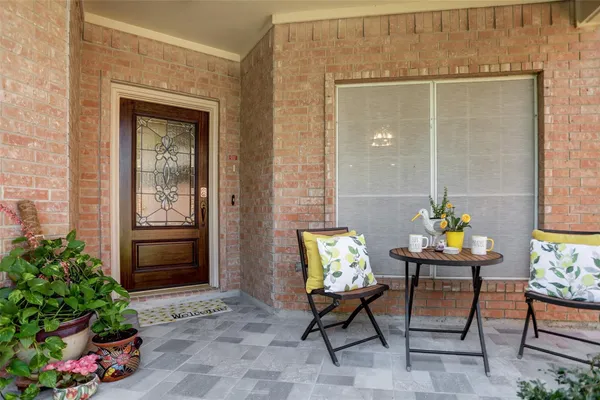a outdoor view with chairs and a potted plant