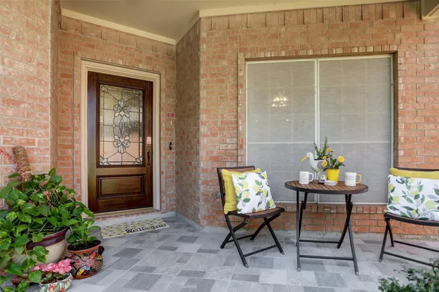 a outdoor view with chairs and a potted plant