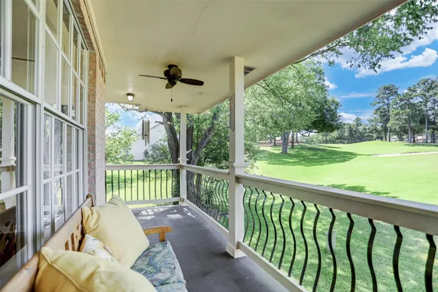 a view of a two chairs in the balcony