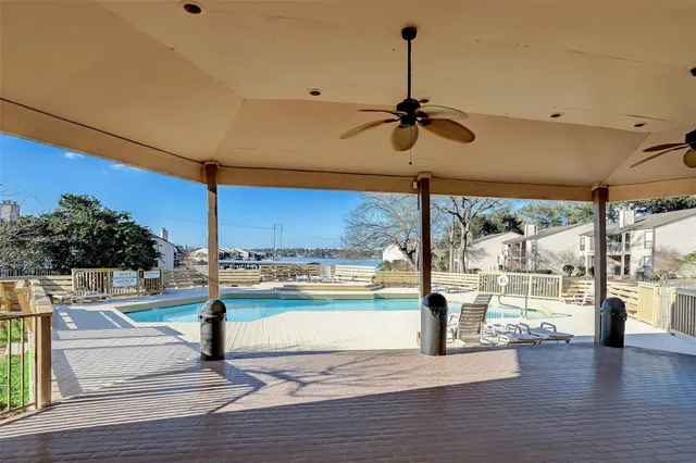 a view of yard with swimming pool and bench