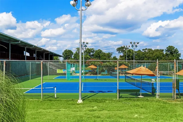 a view of a swimming pool with seating area