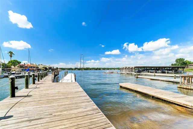 a view of swimming pool with outdoor seating and a garden