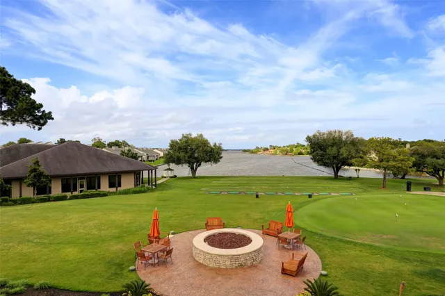 a view of a park with large trees