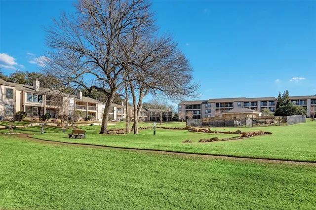a view of a swimming pool with an outdoor seating