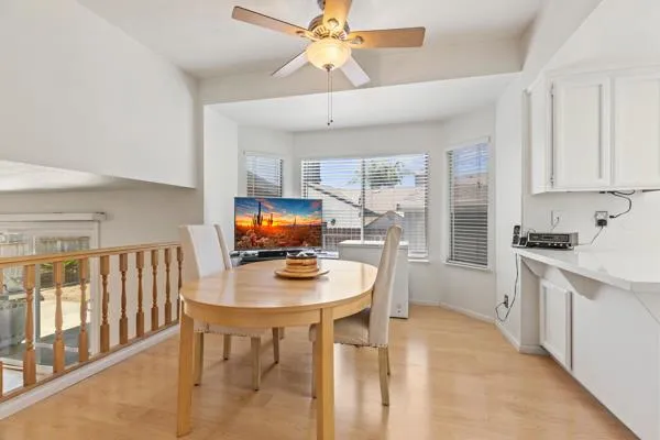 a kitchen with stainless steel appliances a stove a sink a refrigerator a counter space and cabinets