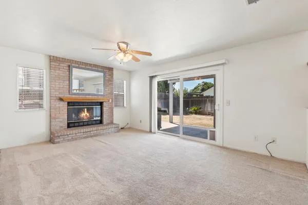 a view of empty room with a fireplace