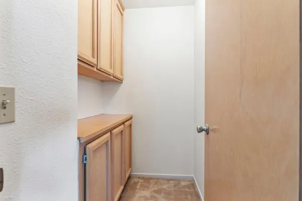 a bathroom with a granite countertop sink a toilet and a mirror