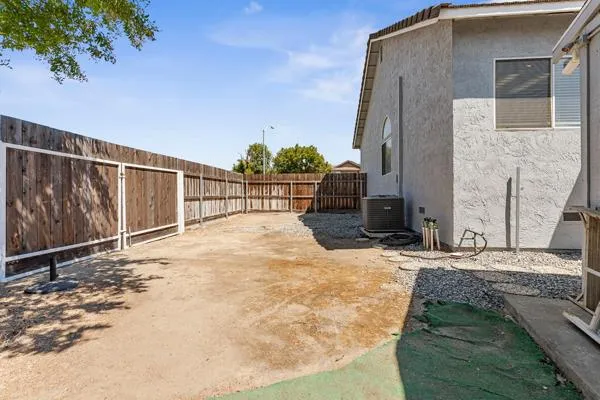 aerial view of a house with backyard
