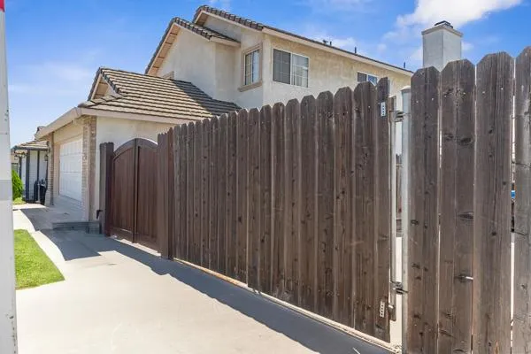 a view of a brick house with a large window