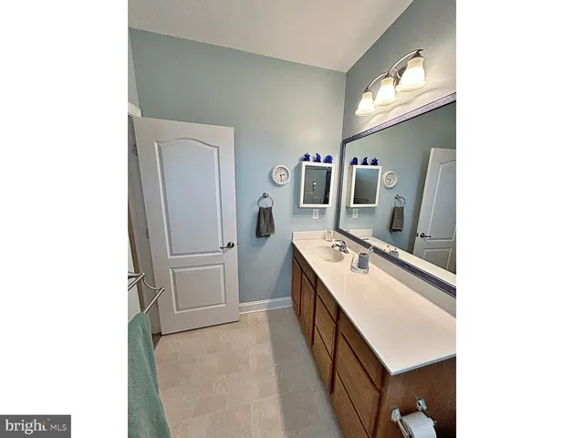 a kitchen with a refrigerator and a sink