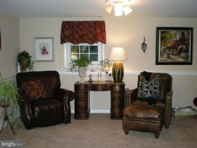 1906 Frederick Road Catonsville, MD 21228 - Photo 10 of 18 Seating area wtih chair rail in lower level