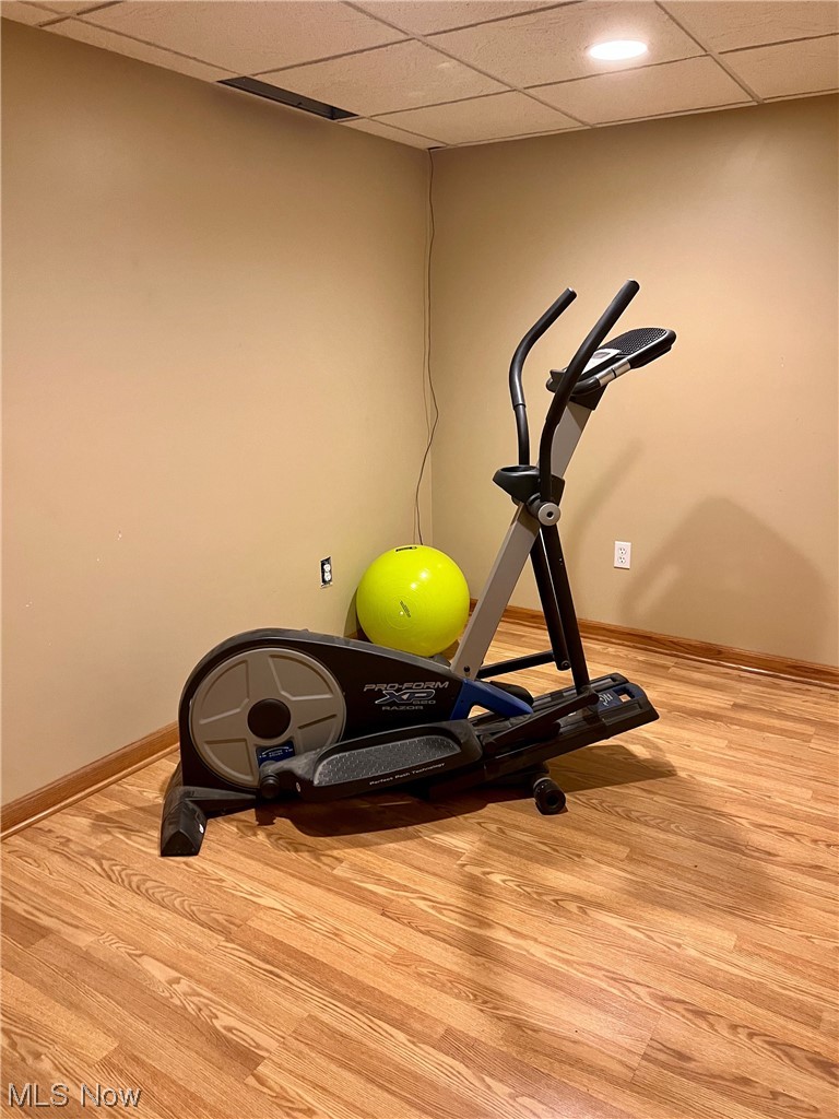 294 Lester Road New Franklin, OH 44319 - Photo 22 of 24 Exercise area featuring light hardwood flooring and a drop ceiling