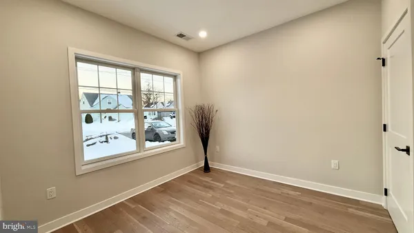 a bathroom with a shower sink and mirror