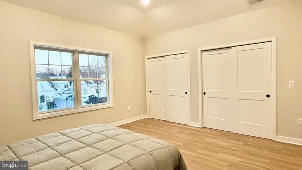a bathroom with a double vanity sink and mirror