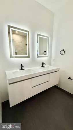 a bathroom with a sink and shower