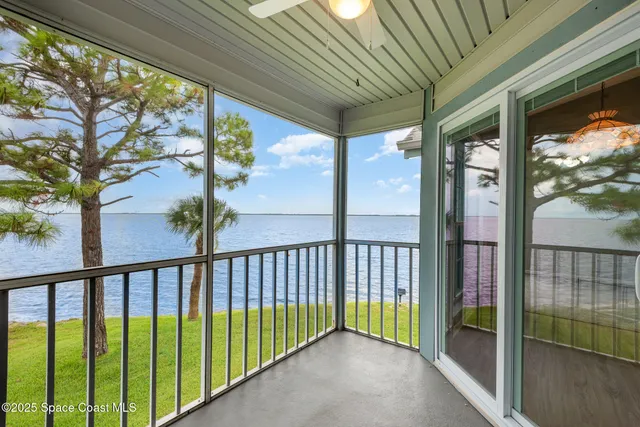 a view of a swimming pool with a yard