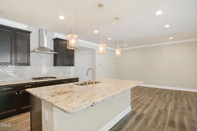 a kitchen with a sink and a refrigerator