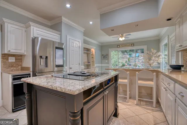 a kitchen with stainless steel appliances granite countertop a stove and a sink