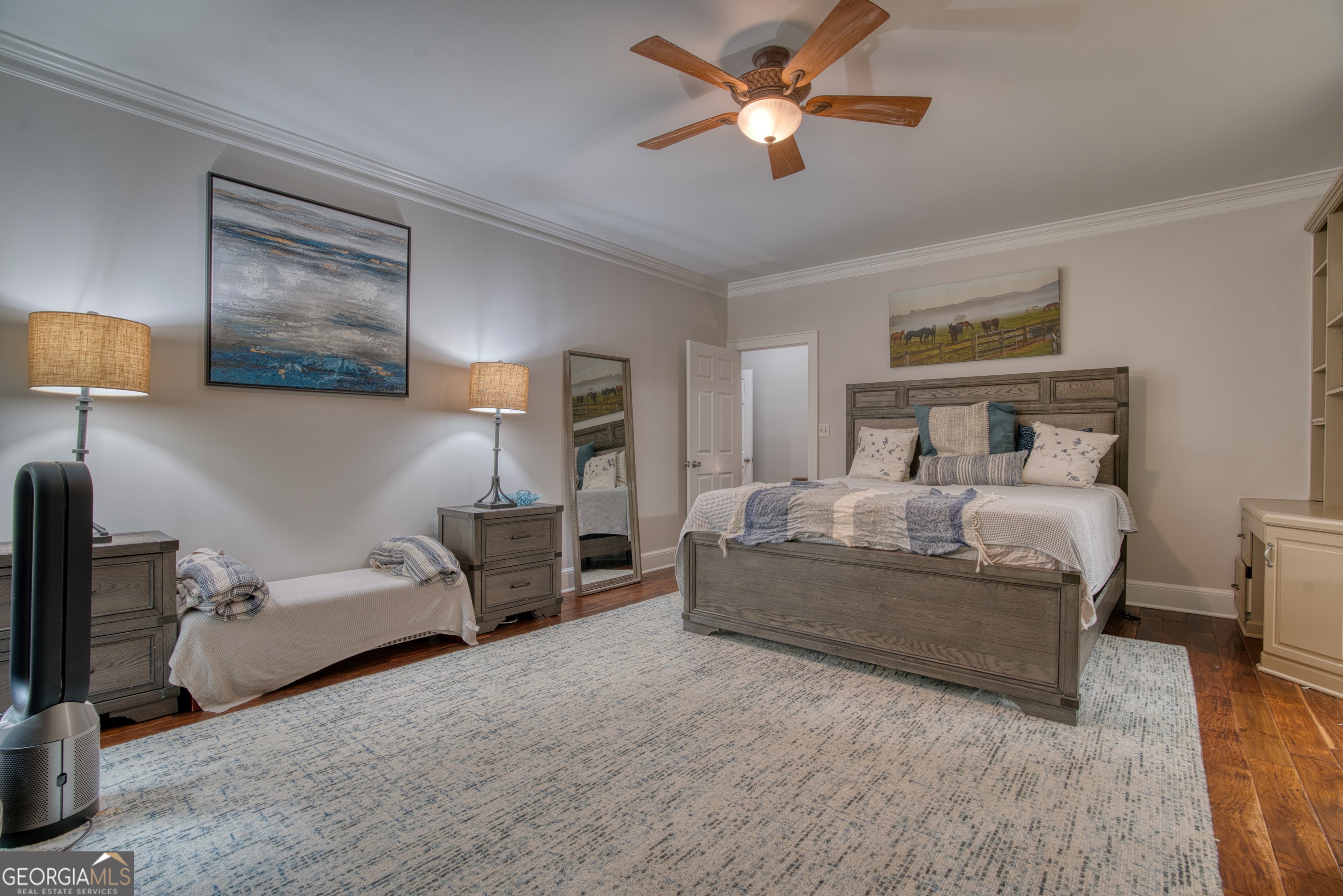 4 Rivermont Drive Southwest Rome, GA 30165 - Photo 25 of 55 a bedroom with a bed and a chandelier