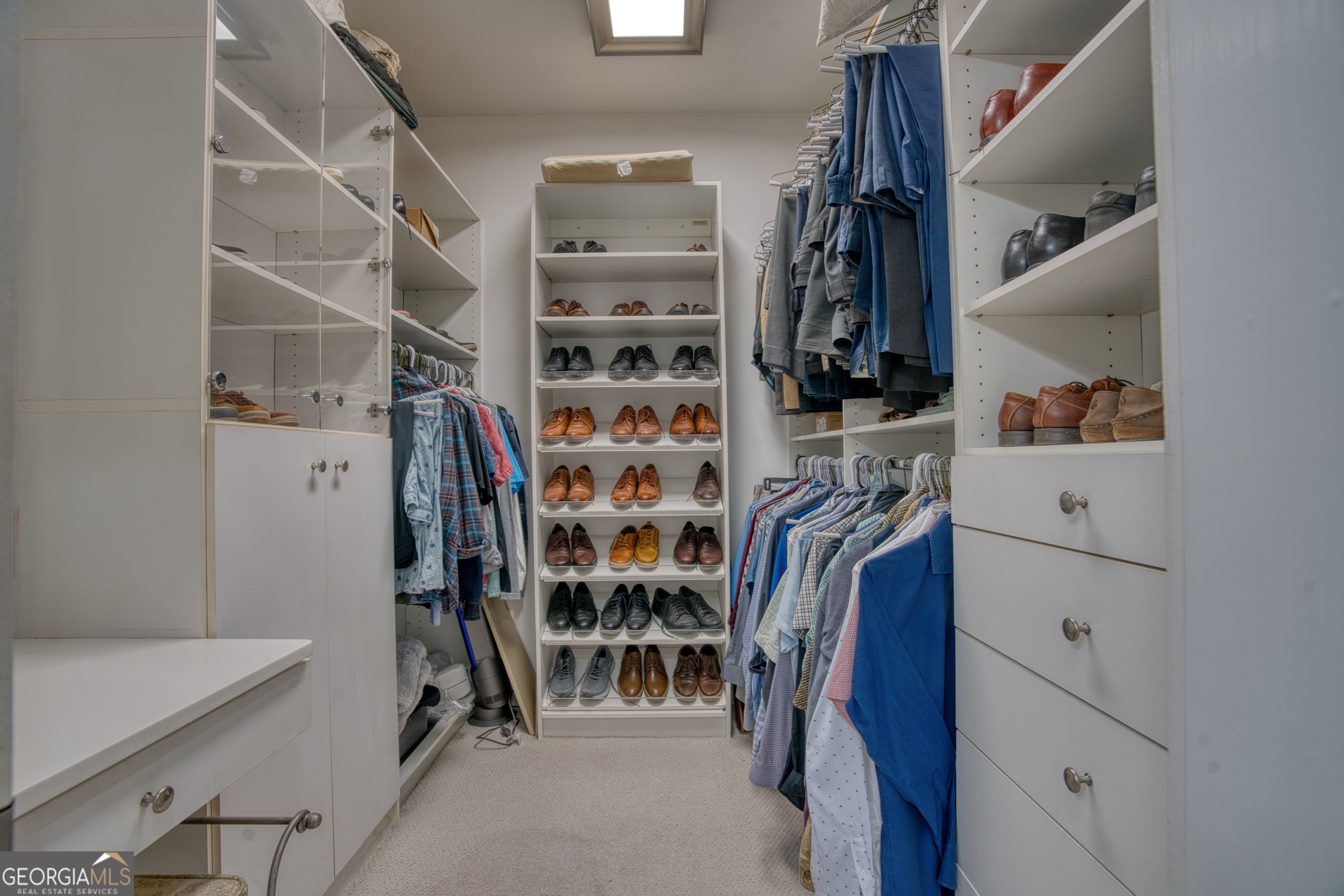 4 Rivermont Drive Southwest Rome, GA 30165 - Photo 29 of 55 a view of walk in closet with clothes and shoes