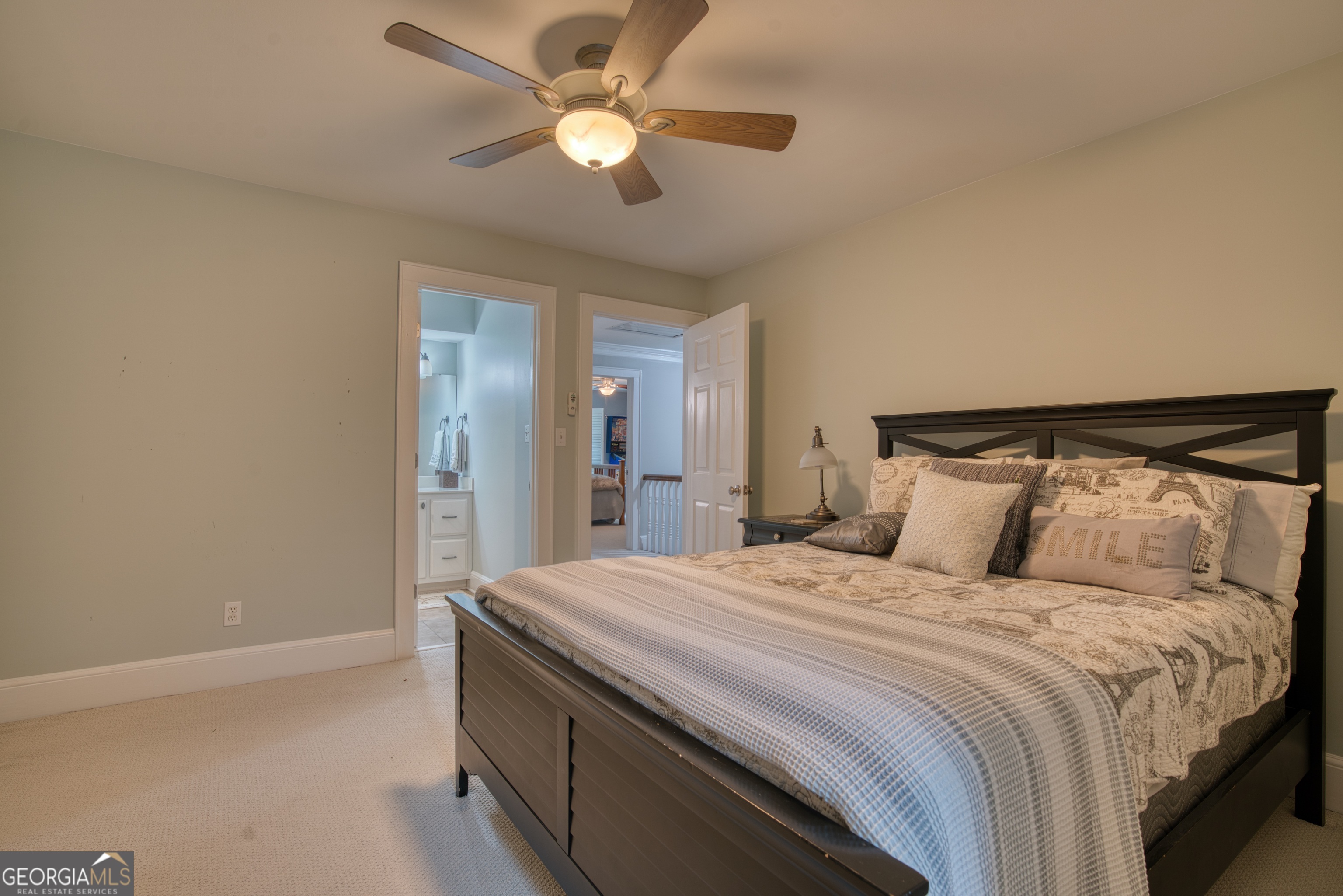 4 Rivermont Drive Southwest Rome, GA 30165 - Photo 33 of 55 a bedroom with a large bed and a ceiling fan