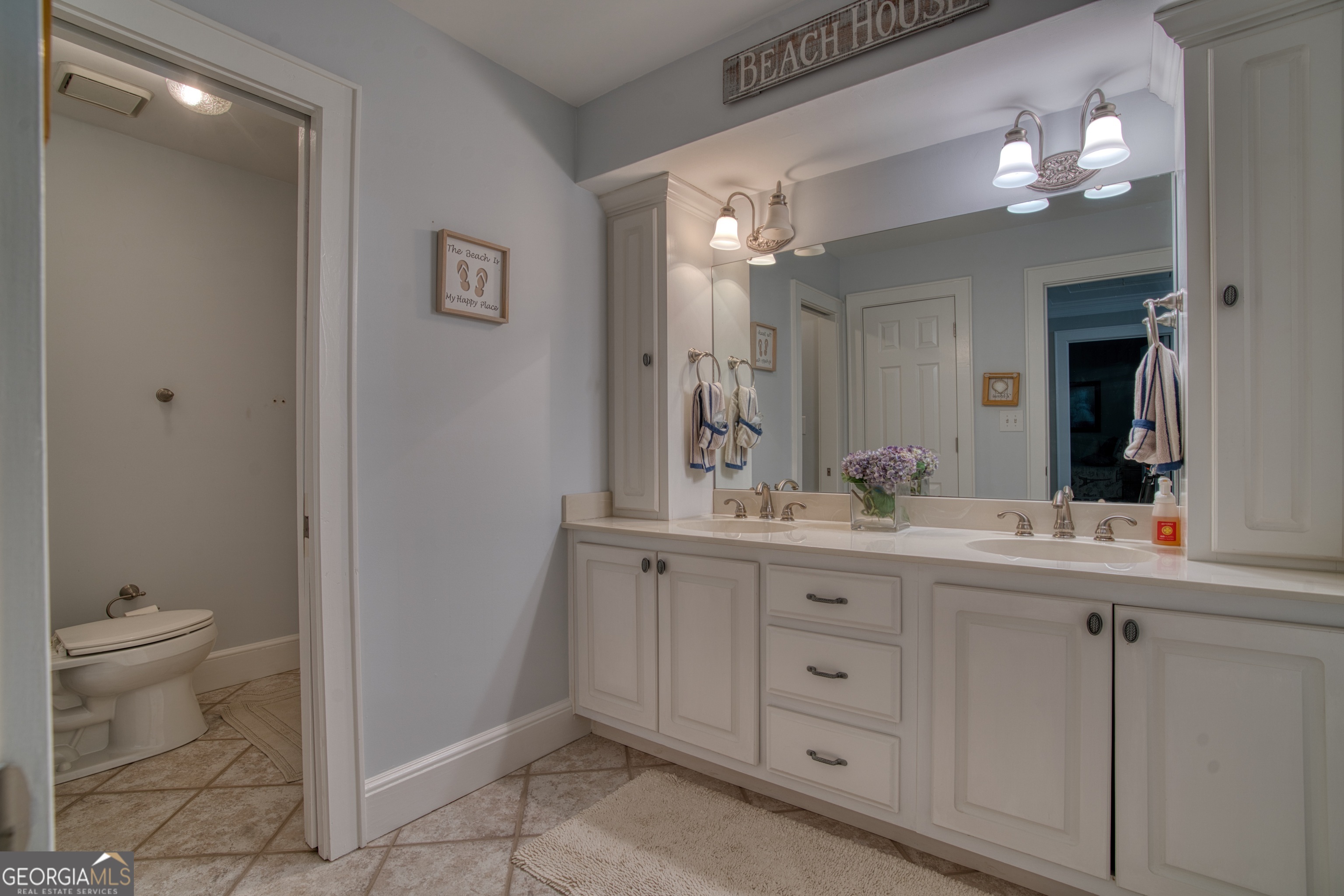 4 Rivermont Drive Southwest Rome, GA 30165 - Photo 36 of 55 a bathroom with a double vanity sink and a toilet