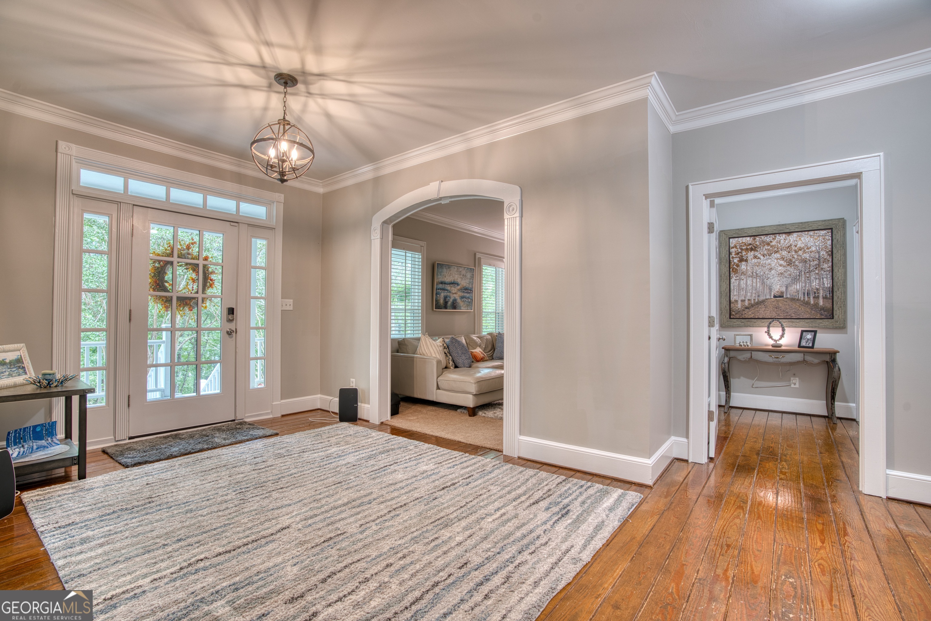4 Rivermont Drive Southwest Rome, GA 30165 - Photo 7 of 55 a view of a livingroom with wooden floor and a chandelier