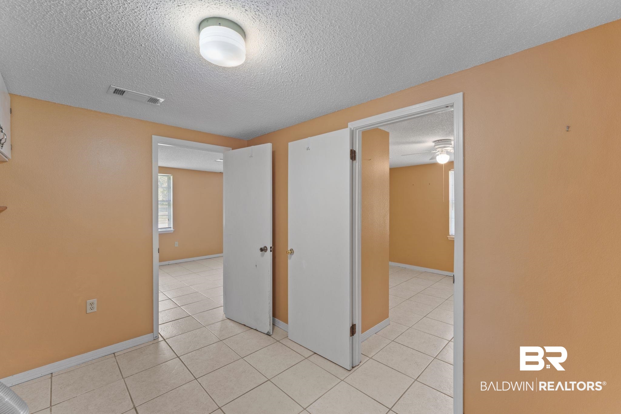 14095 Riverside Drive Foley, AL 36535 - Photo 13 of 30 Spare room with a textured ceiling and light tile patterned floors