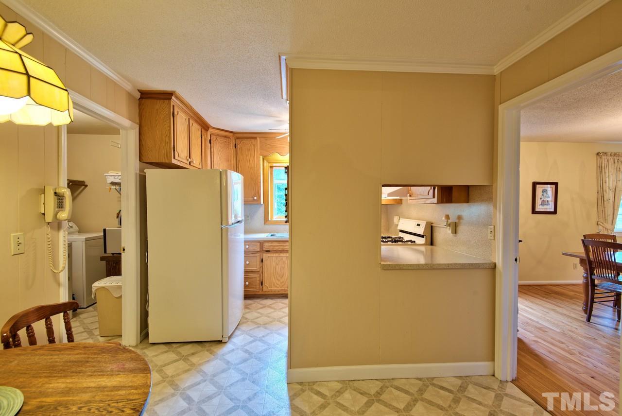 3607 Cole Mill Road Durham, NC 27712 - Photo 11 of 25 This is a view of the kitchen area. To the Left is the Laundry Room (Washer and Dryer convey) and to the Right is the Living Room.