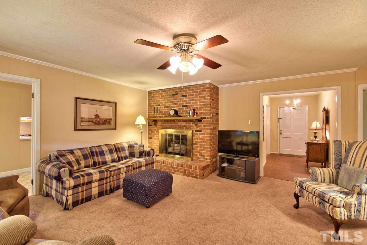 3607 Cole Mill Road Durham, NC 27712 - Photo 13 of 25 The Family room features a brick fireplace with gas logs. Ceiling fans are in most of the rooms.
