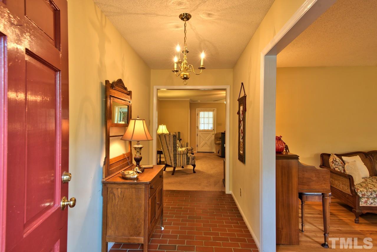 3607 Cole Mill Road Durham, NC 27712 - Photo 3 of 25 The Foyer greets you with a brick floor entry that opens to Hardwood Floors throughout most of the main level.
