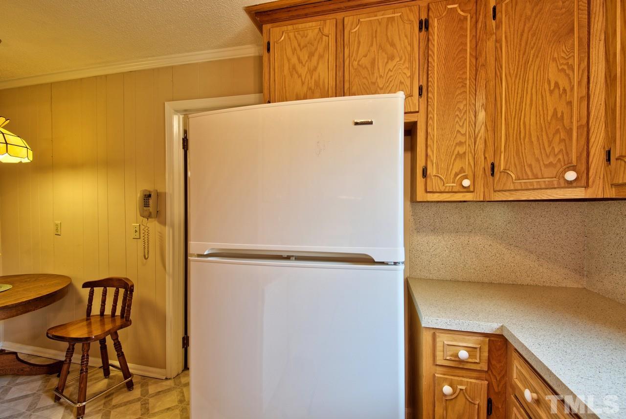 3607 Cole Mill Road Durham, NC 27712 - Photo 10 of 25 The Refrigerators in the Kitchen and Laundry Room convey with the home.