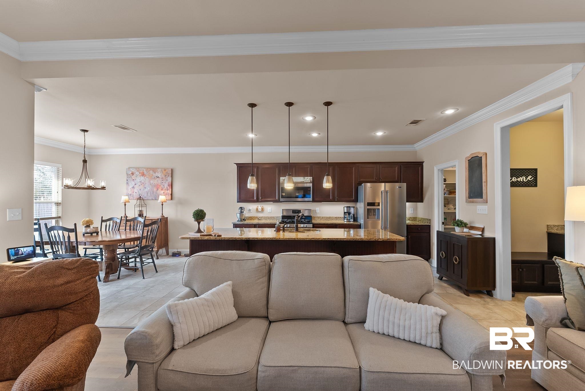 7015 Rocky Rd Loop Gulf Shores, AL 36542 - Photo 10 of 41 Living area with ornamental molding, light tile patterned floors, and recessed lighting
