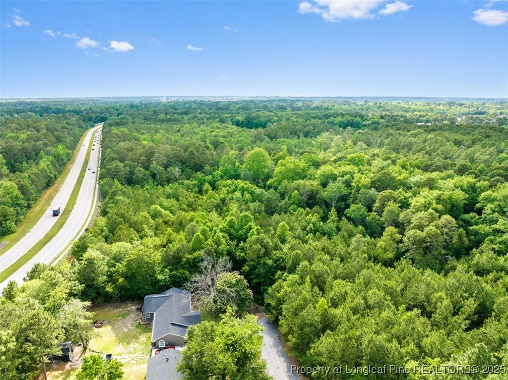 3165 George Owen Road Fayetteville, NC 28306 - Photo 11 of 17 a view of a garden with a building