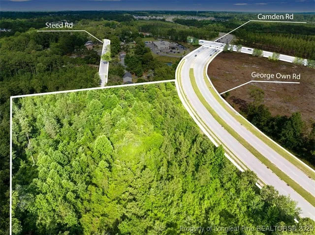 a view of a swimming pool with a outdoor seating