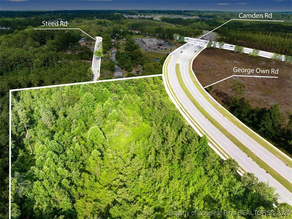 3165 George Owen Road Fayetteville, NC 28306 - Photo 3 of 17 a view of a swimming pool with a outdoor seating