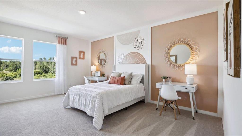 2306 Rikkola Lane Wesley Chapel, FL 33543 - Photo 14 of 28 a bedroom with a bed and a window