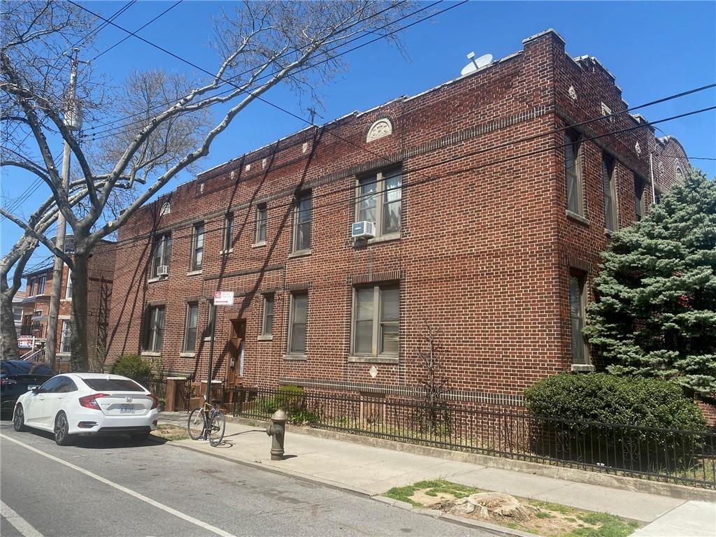 1175 66th Street Brooklyn, NY 11219 - Photo 2 of 17 a car parked in front of a building