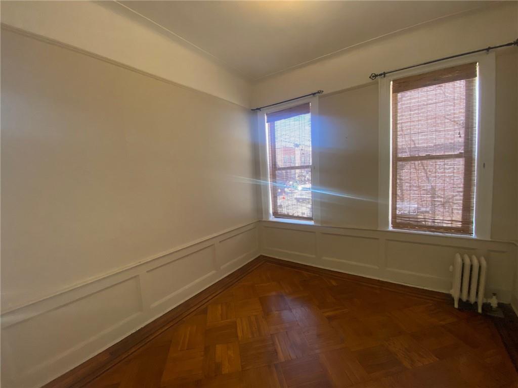 1175 66th Street Brooklyn, NY 11219 - Photo 8 of 17 an empty room with a window