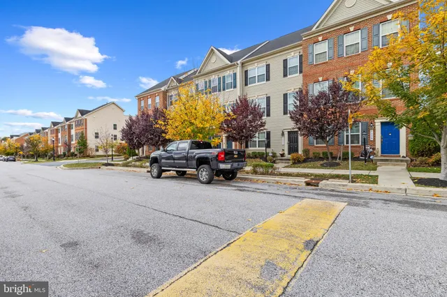 a view of a building with cars parked